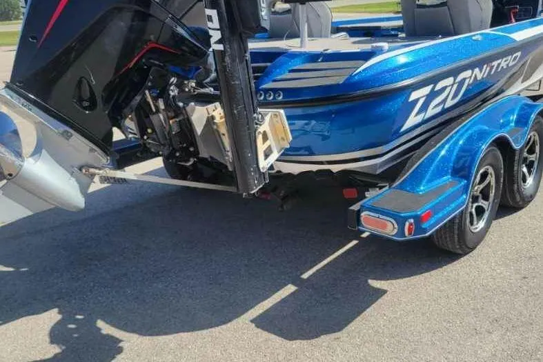 Slide: The Image of Blue 2019 Nitro Z20 Pro boat on trailer, featuring powerful outboard motor. - 3
