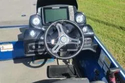 Slide: The Image of Nitro Z20 Pro 2019 boat dashboard with steering wheel and electronic display. - 5