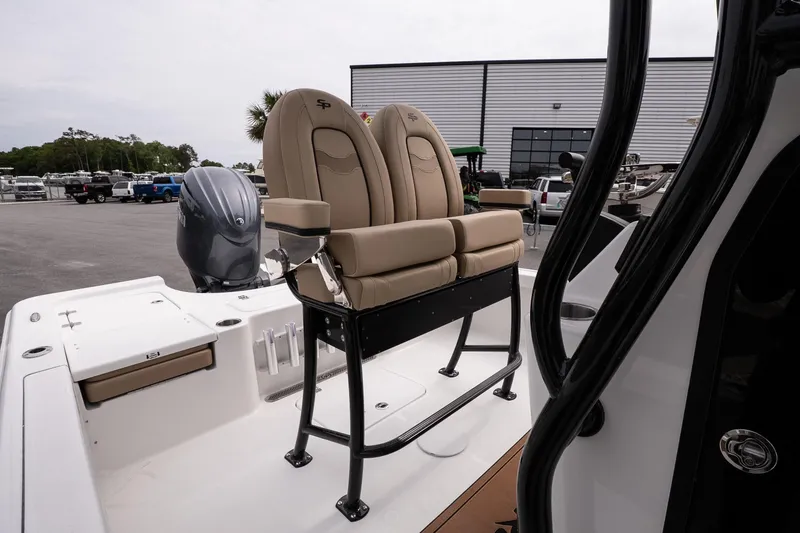 Slide: The Image of 2026 Sea Pro 230 Bay boat with tan seating and outboard motor. - 11