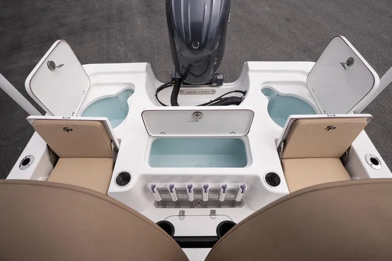 Slide: The Image of 2026 Sea Pro 230 Bay boat interior with storage compartments and seating. - 14