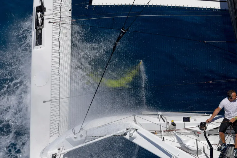 Slide: The Image of Sailing on CDK Technologies MOD 70, 2012 model, cutting through ocean waves. - 11