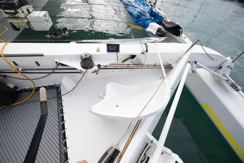 Slide: The Image of Cockpit view of 2012 CDK Technologies MOD 70 sailboat, featuring ropes and equipment. - 12