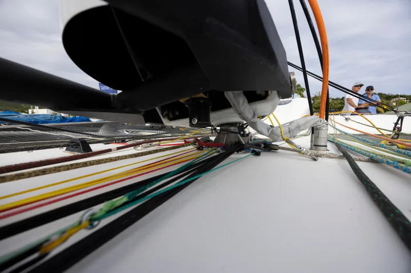 Slide: The Image of Close-up of CDK Technologies MOD 70 sailboat rigging, 2012 model, with colorful ropes and equipment. - 18