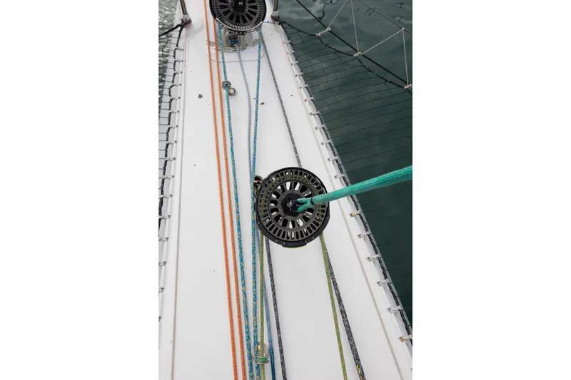Slide: The Image of Deck view of CDK Technologies MOD 70 sailboat, showcasing colorful ropes and pulleys. - 23