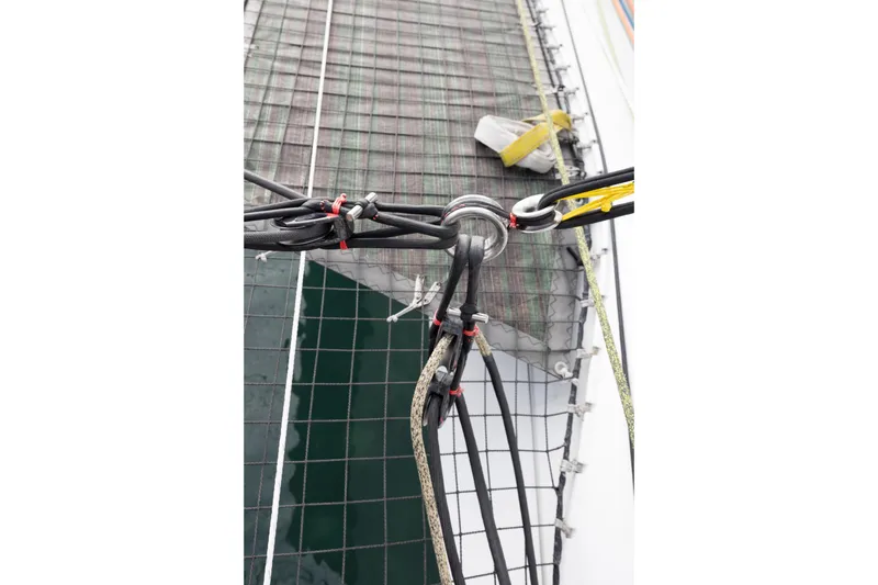 Slide: The Image of Rope rigging on CDK Technologies MOD 70 sailboat, 2012 model, with netting and hardware. - 28