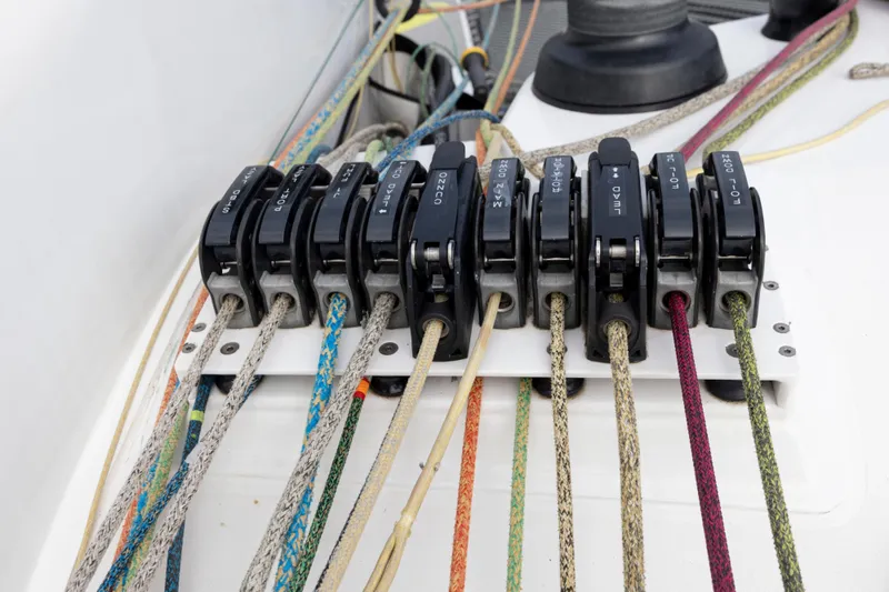 Slide: The Image of Colorful ropes and clutches on a 2012 CDK Technologies MOD 70 sailboat. - 29