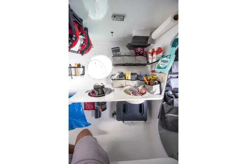 Slide: The Image of Interior of 2012 CDK Technologies MOD 70 yacht, featuring organized storage and supplies. - 35