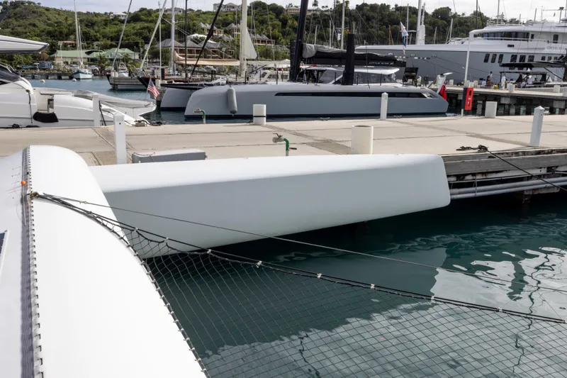 Slide: The Image of Trimaran sailboat CDK Technologies MOD 70 docked at marina, 2012 model. - 36