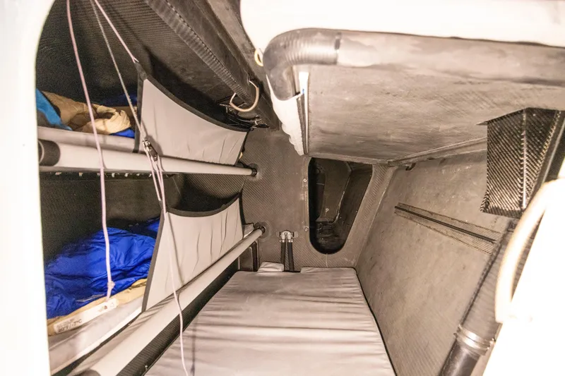 Slide: The Image of Interior of 2012 CDK Technologies MOD 70 sailboat, featuring compact sleeping quarters. - 40