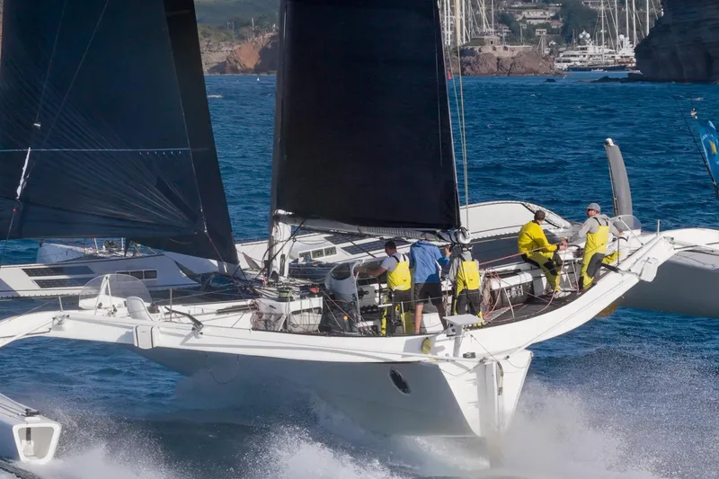 Slide: The Image of Sailing yacht CDK Technologies MOD 70, 2012 model, navigating ocean waters with crew. - 5