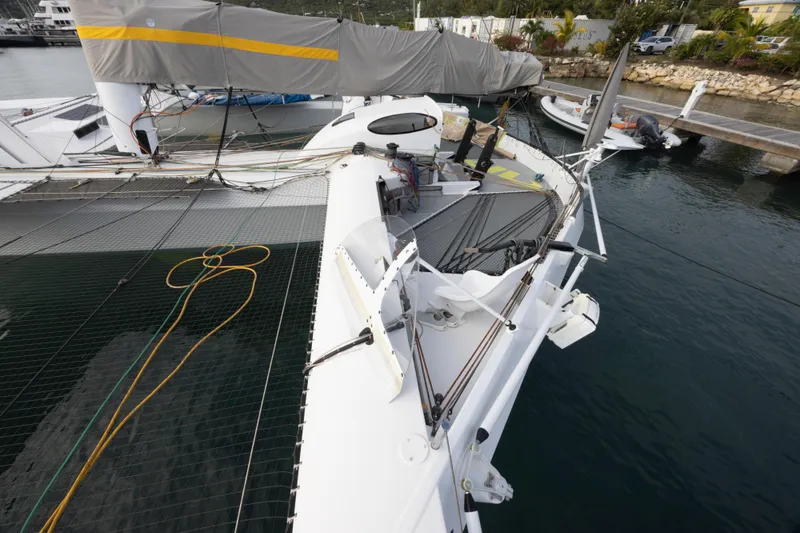 Slide: The Image of Sailing trimaran CDK Technologies MOD 70, 2012 model, docked at marina. - 54