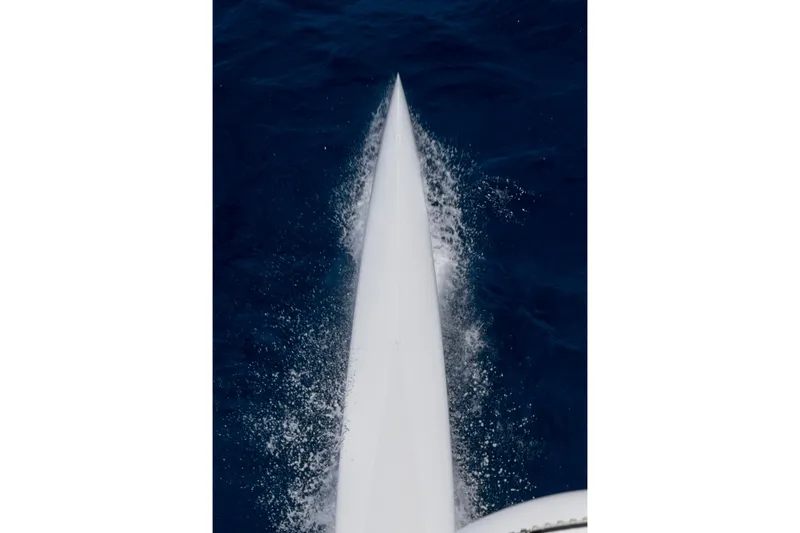 Slide: The Image of Bow of CDK Technologies MOD 70 yacht cutting through ocean waves, 2012 model. - 60