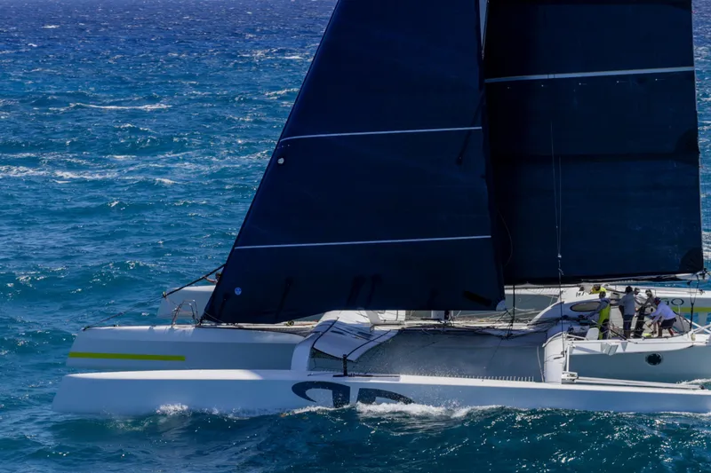 Slide: The Image of Sailing yacht CDK Technologies MOD 70, 2012, navigating blue ocean waters. - 66