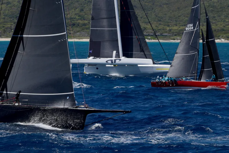 Slide: The Image of Sailboats racing on blue ocean, featuring CDK Technologies MOD 70, 2012 model. - 7
