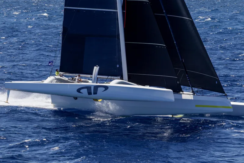 Slide: The Image of Sailing yacht CDK Technologies MOD 70, 2012 model, gliding on open ocean waters. - 8