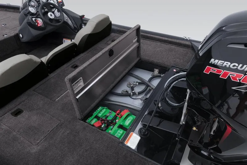 Slide: The Image of 2018 Tracker Pro Team 190 TX boat engine and battery compartment. - 29