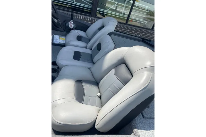 Slide: The Image of 2018 Tracker Pro Team 190 TX boat interior with gray cushioned seats. - 3