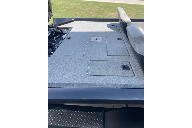 Slide: The Image of 2018 Tracker Pro Team 190 TX boat deck with storage compartments. - 6