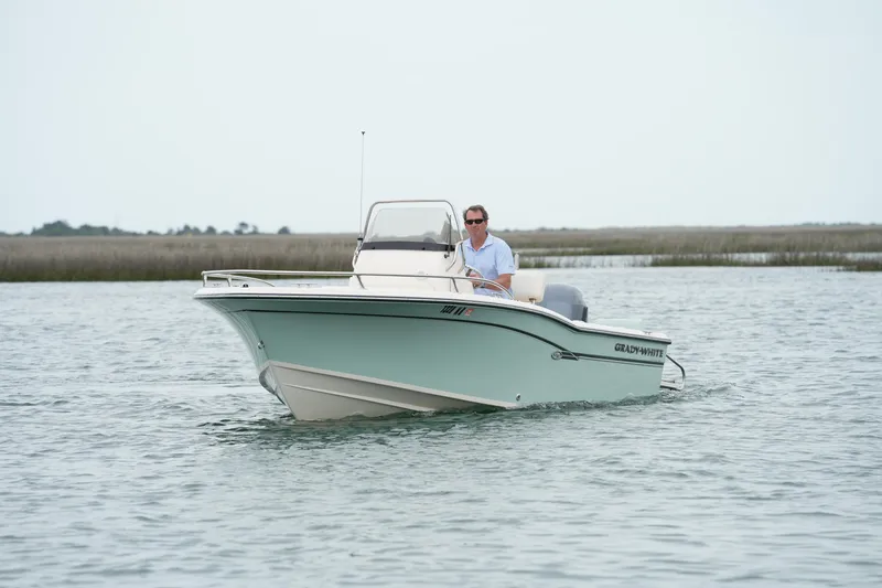 The Image of 2019 Grady-White Fisherman 180 boat cruising on calm waters. - 0
