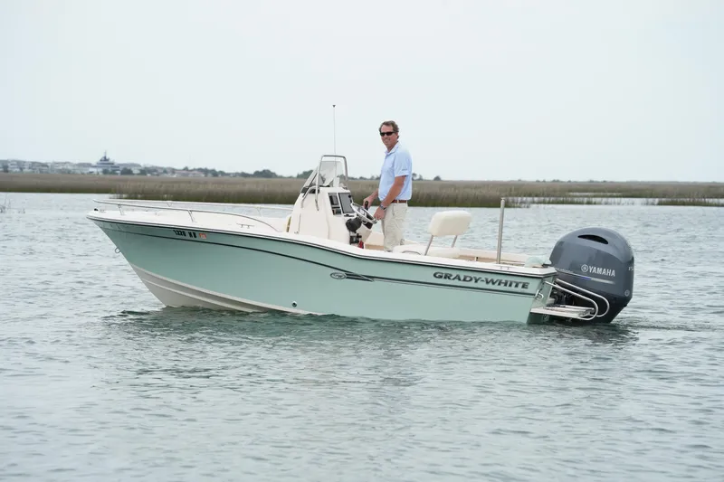 Slide: The Image of 2019 Grady-White Fisherman 180 boat on water with Yamaha engine. - 11