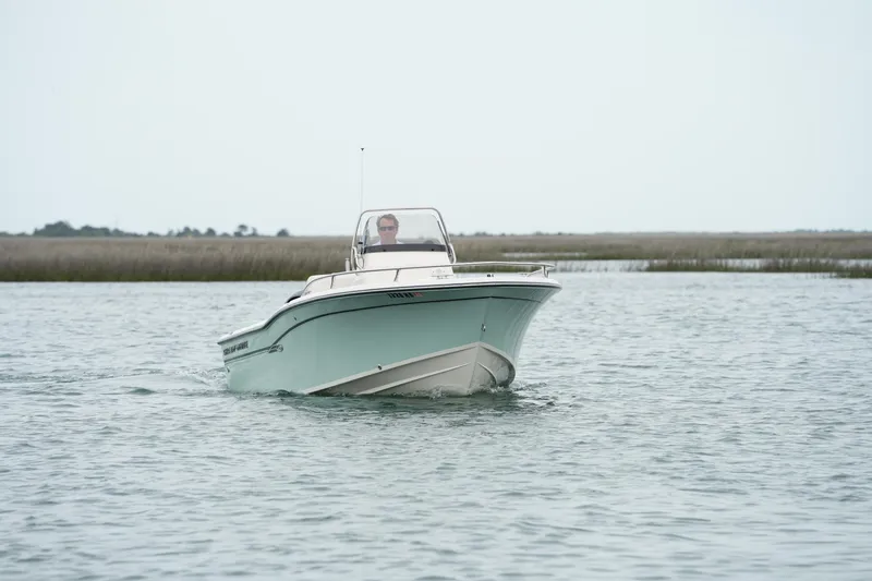 Slide: The Image of 2019 Grady-White Fisherman 180 boat cruising on calm waters. - 2