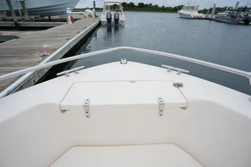 Slide: The Image of 2019 Grady-White Fisherman 180 boat docked at marina, view from bow. - 25