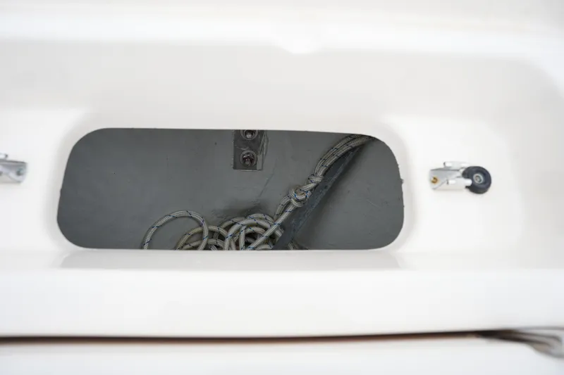 Slide: The Image of Storage compartment with rope on a 2019 Grady-White Fisherman 180 boat. - 26