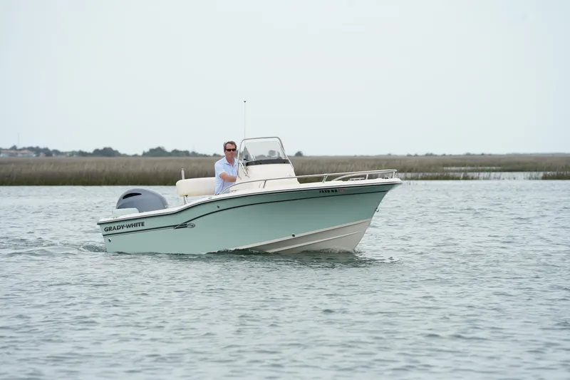 Slide: The Image of 2019 Grady-White Fisherman 180 boat cruising on calm waters. - 3