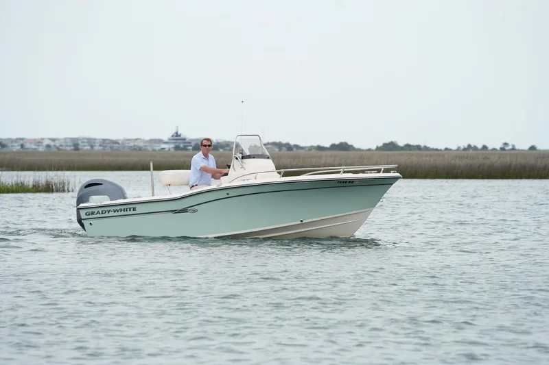 Slide: The Image of 2019 Grady-White Fisherman 180 boat cruising on calm waters. - 4