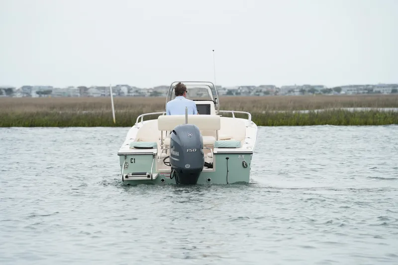 Slide: The Image of 2019 Grady-White Fisherman 180 boat on water, rear view with Yamaha engine. - 8