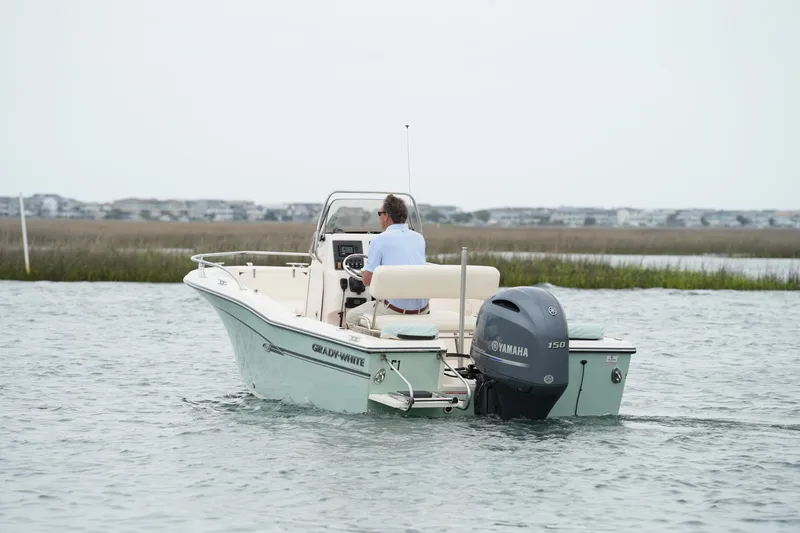 Slide: The Image of 2019 Grady-White Fisherman 180 boat cruising on calm waters with Yamaha engine. - 9