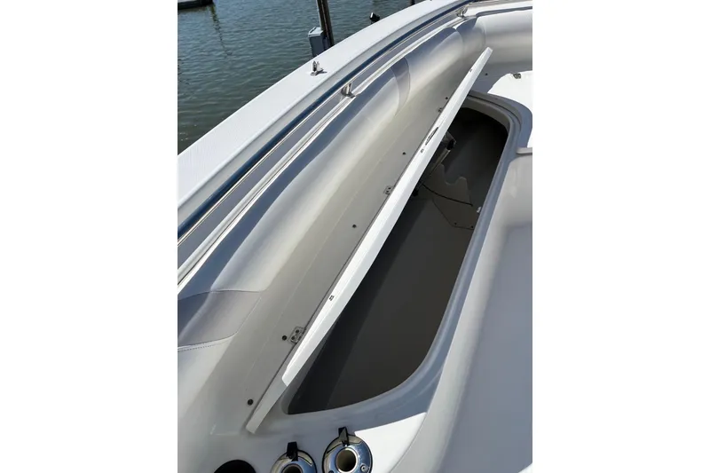Slide: The Image of 2005 Boston Whaler 320 Outrage boat console with steering wheel and controls. - 10