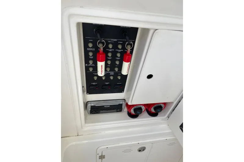 Slide: The Image of 2005 Boston Whaler 320 Outrage helm covered, showcasing sturdy metal framework. - 21