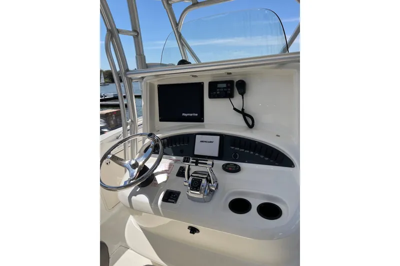 Slide: The Image of 2005 Boston Whaler 320 Outrage boat docked by the water. - 3