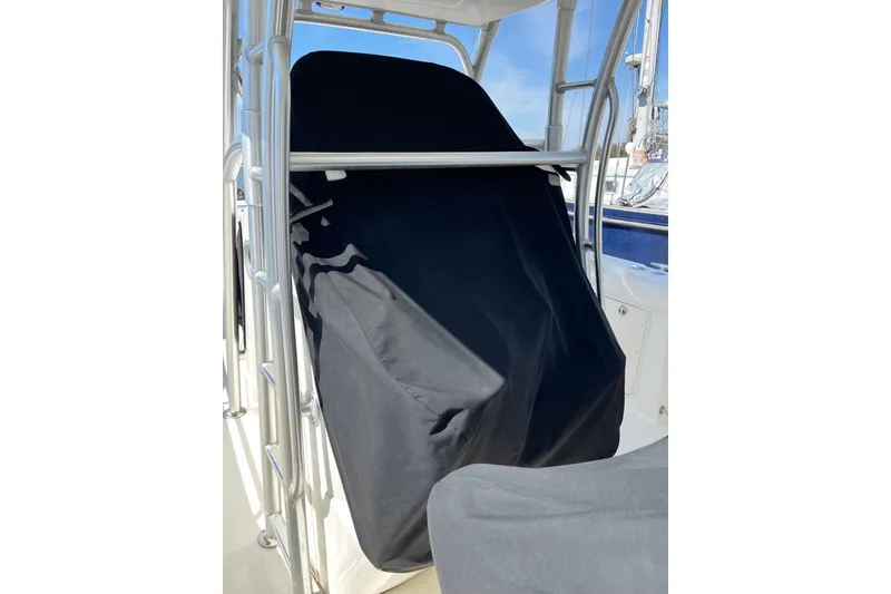 Slide: The Image of 2005 Boston Whaler 320 Outrage boat console with steering wheel and navigation equipment. - 9