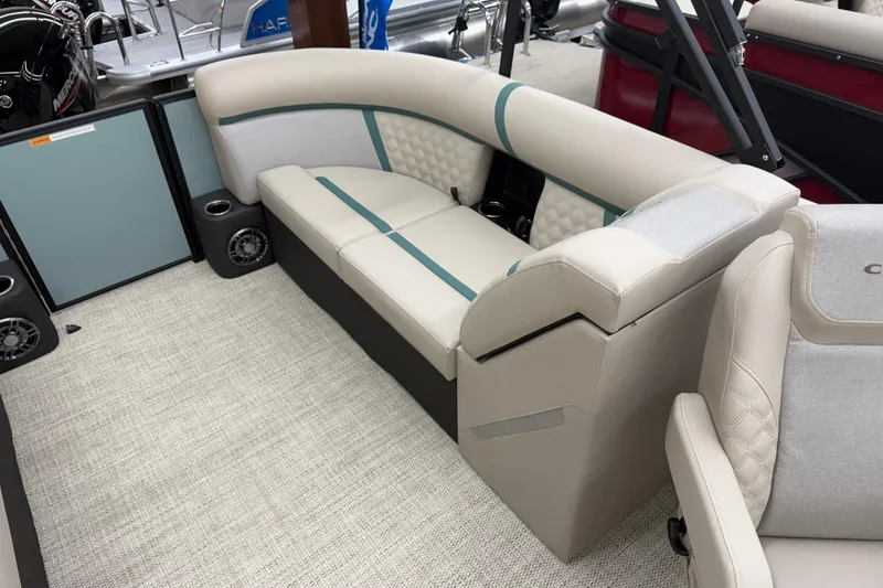 Slide: The Image of Luxurious seating on 2026 Crest Conquest 230 SLC pontoon boat, featuring elegant upholstery and cup holders. - 11