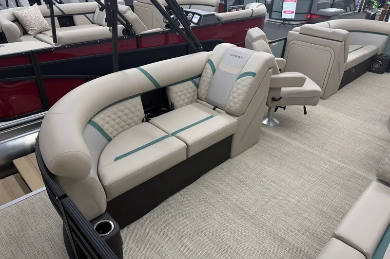 Slide: The Image of 2026 Crest Conquest 230 SLC pontoon boat interior with luxurious seating and modern design. - 14