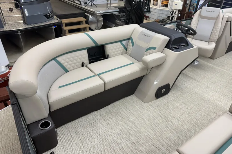 Slide: The Image of Luxurious interior of 2026 Crest Conquest 230 SLC pontoon boat with plush seating. - 4