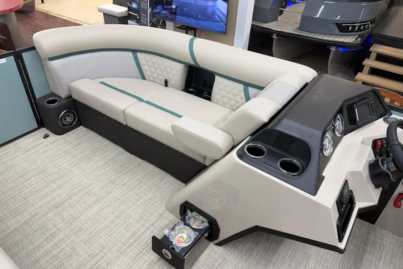Slide: The Image of Luxurious interior of 2026 Crest Conquest 230 SLC pontoon boat with plush seating and modern dashboard. - 6