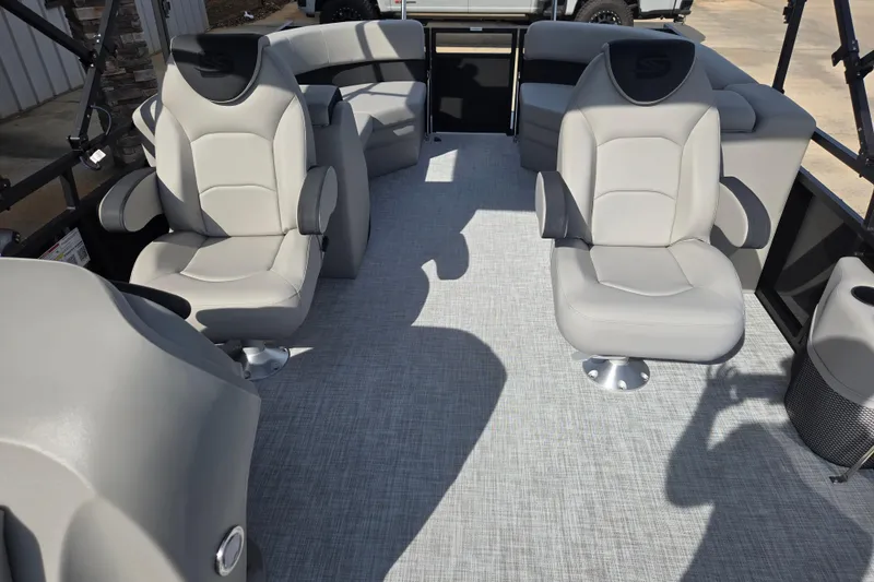 Slide: The Image of Interior of 2026 Dockside 22DQ2.75 boat with modern seating and carpeted floor. - 13