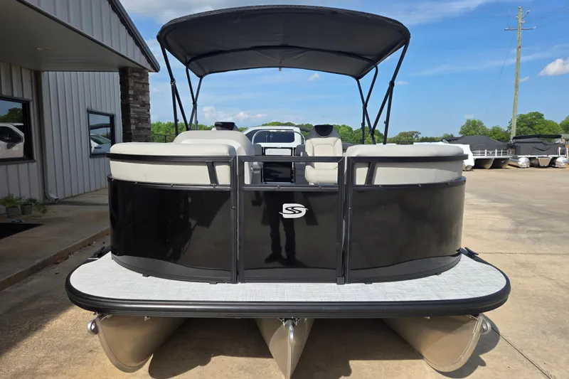 Slide: The Image of 2026 Dockside 22DQ2.75 pontoon boat with canopy, parked outdoors on a sunny day. - 14