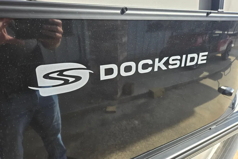 Slide: The Image of 2026 Dockside 22DQ2.75 boat logo on a reflective surface. - 15