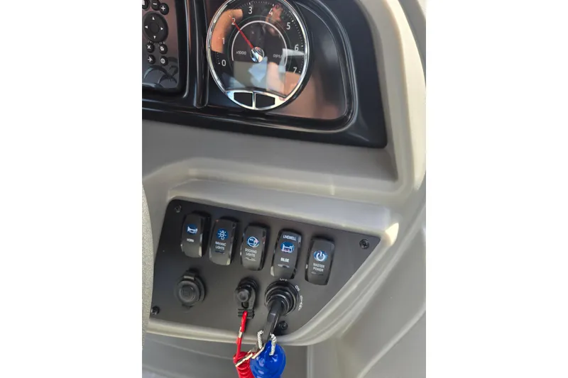 Slide: The Image of Control panel of Dockside 22DQ2.75 boat, featuring switches and gauges, 2026 model. - 4