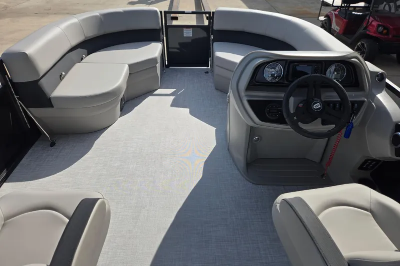 Slide: The Image of Interior of 2026 Dockside 22DQ2.75 pontoon boat with modern seating and steering console. - 8
