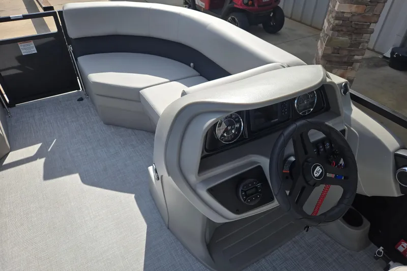 Slide: The Image of Interior of 2026 Dockside 22DQ2.75 boat with modern steering and seating. - 9