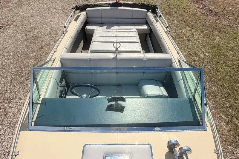 Slide: The Image of 1984 Century Resorter boat interior with vintage seating and steering wheel. - 6
