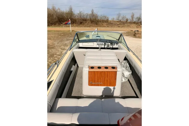 Slide: The Image of 1984 Century Resorter boat interior with classic dashboard and seating. - 7