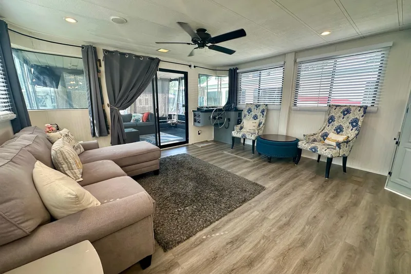 Slide: The Image of Spacious Lakeview 15x70 houseboat interior, featuring cozy seating and modern decor, 1995 model. - 5