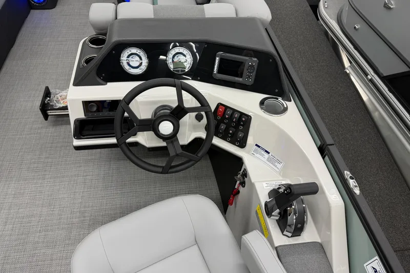 Slide: The Image of Steering console of 2026 Crest Conquest 230 SLSC boat with modern controls and gauges. - 10