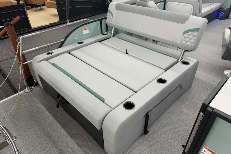 Slide: The Image of 2026 Crest Conquest 230 SLSC boat interior with gray seating and cup holders. - 13